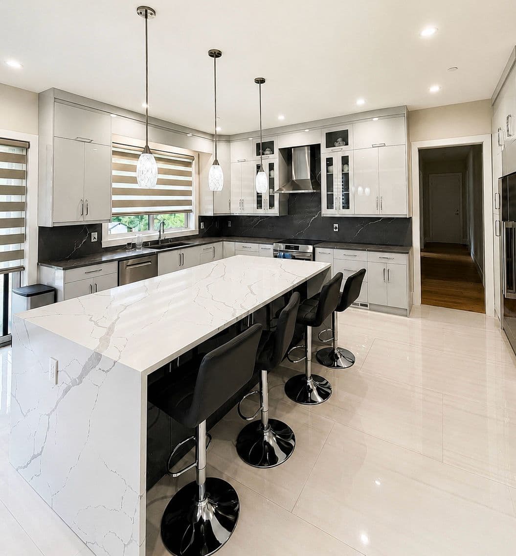White kitchen with waterfall island