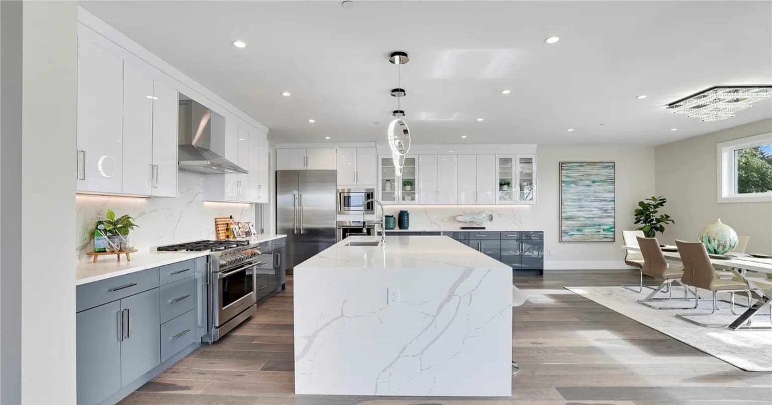 White kitchen with island and view