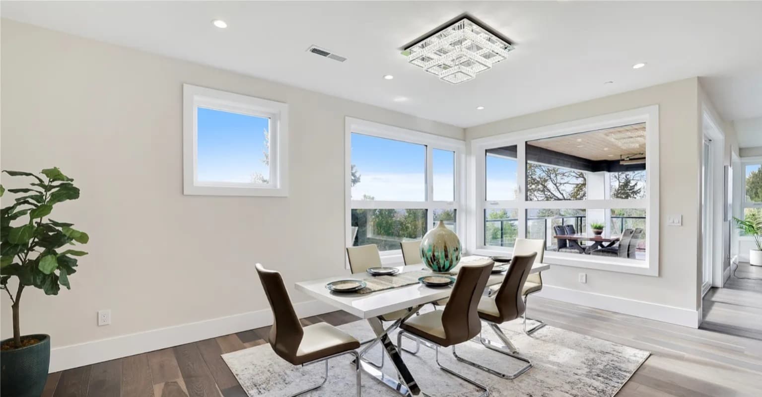 Dining area with chandelier and views